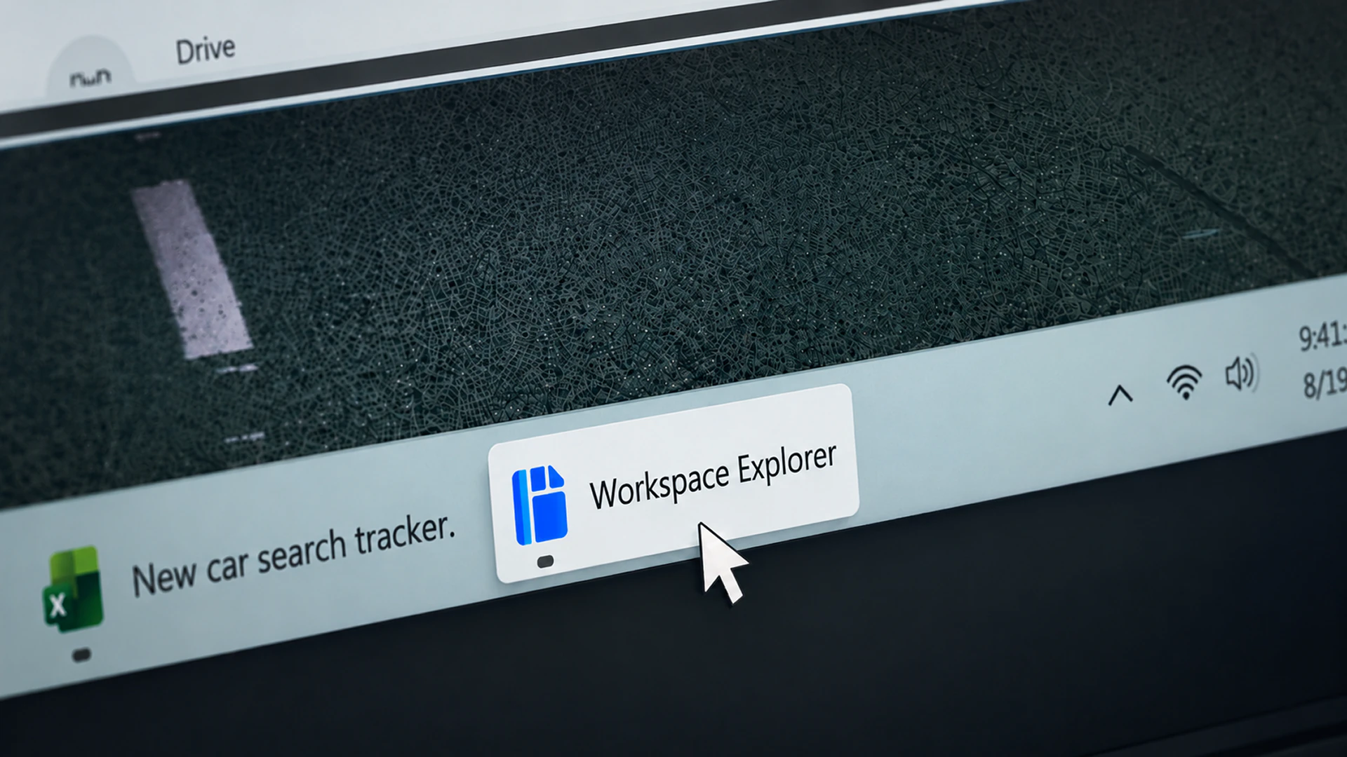 Angled close-up of a Windows desktop taskbar with the Workspace Explorer button in the foreground