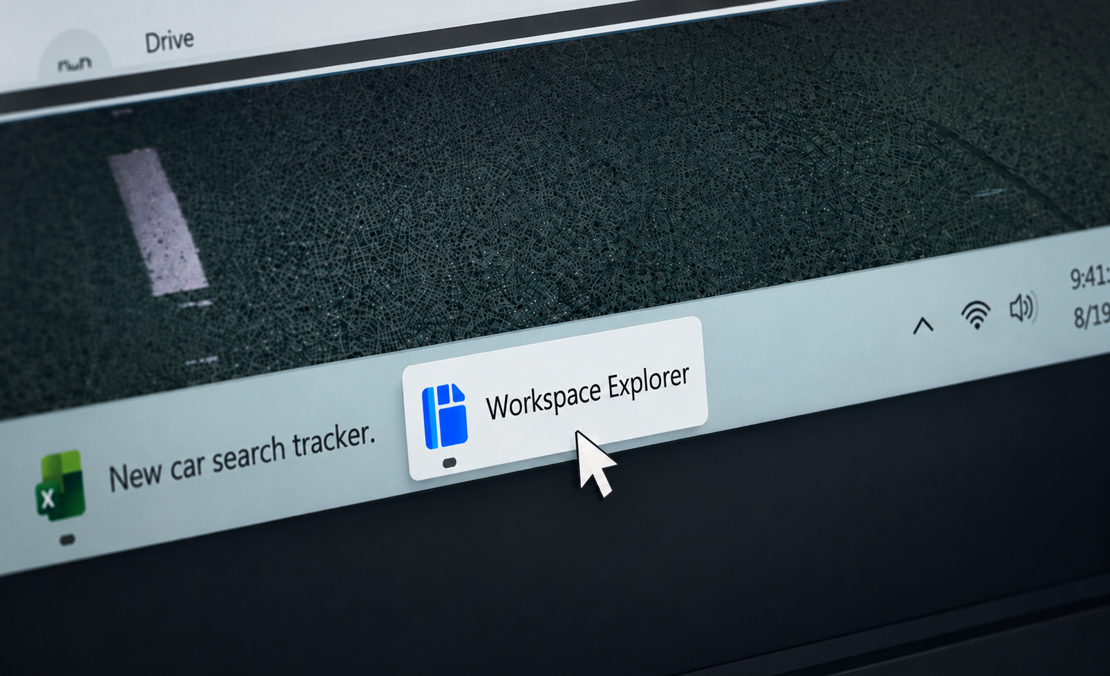 Angled close-up of a Windows desktop taskbar with the Workspace Explorer button in the foreground